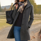Women’s long winter coat in dark gray with button-front closure and lapels