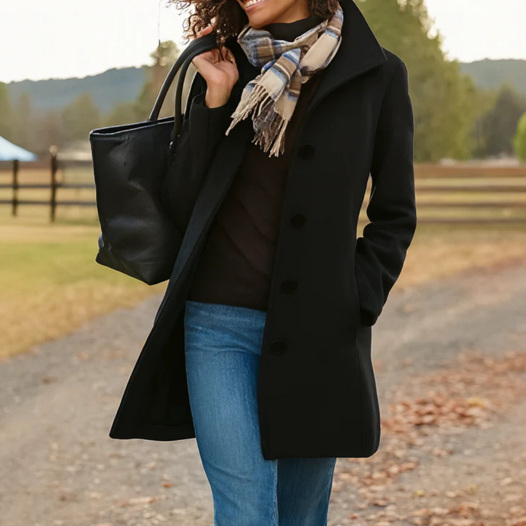 Women’s long winter coat in black with button-front closure and lapels