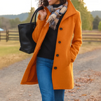 Women’s long winter coat in orange with button-front closure and lapels