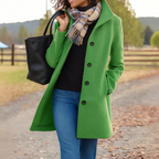 Women’s long winter coat in green with button-front closure and lapels